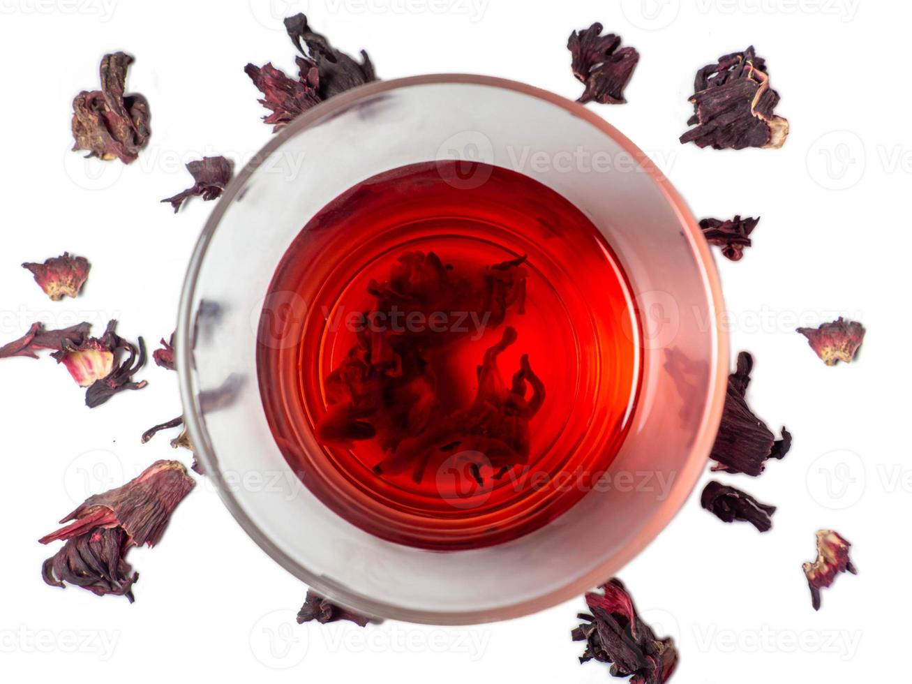 Karkade. Tea drink in a glass. Red liquid in a glass. photo