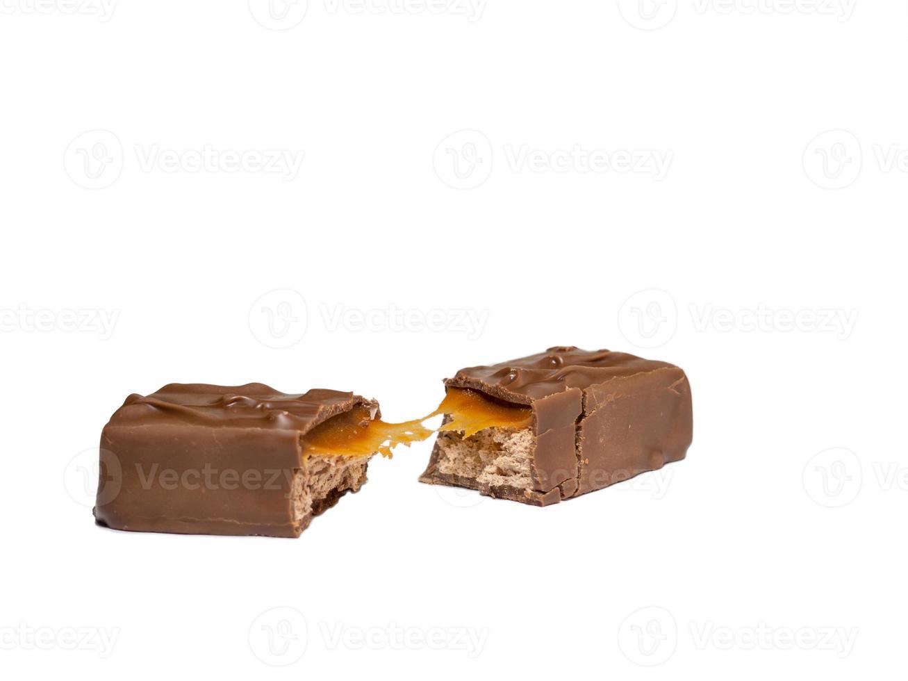 Broken chocolate bar on a white background. photo