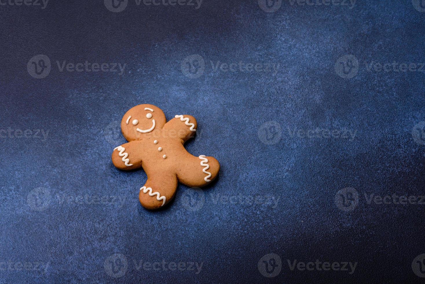 Christmas homemade gingerbread cookies on a dark concrete table photo