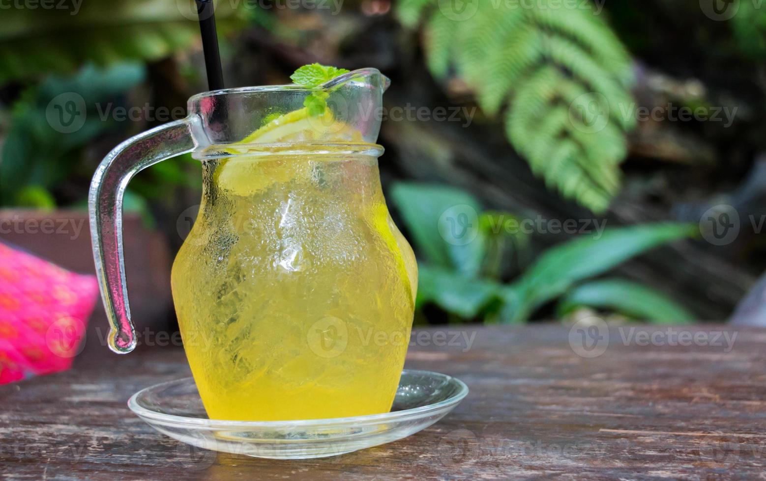 jar of lemon honey on table photo