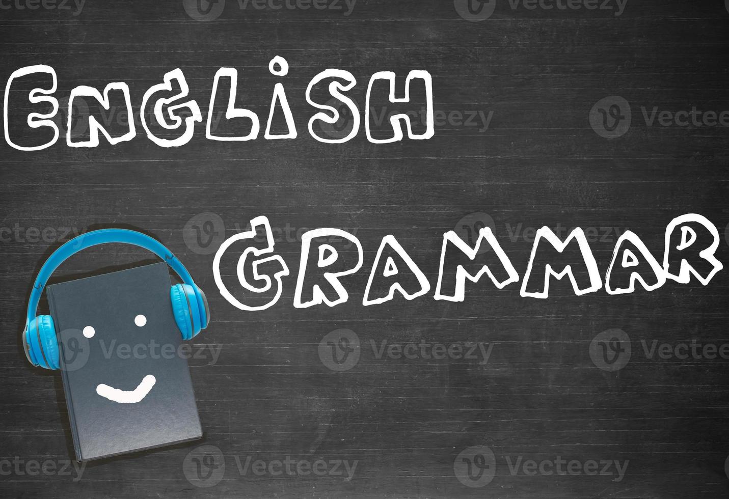 drawing english grammar over blackboard photo