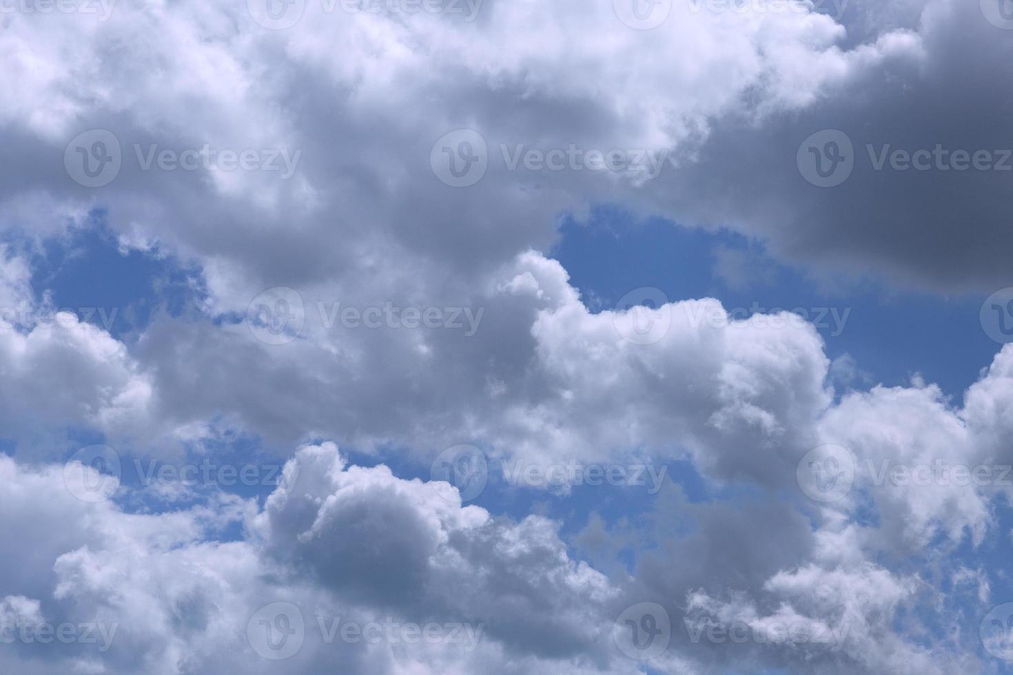 Heavenly cloudy landscape, white and gray clouds against the blue sky