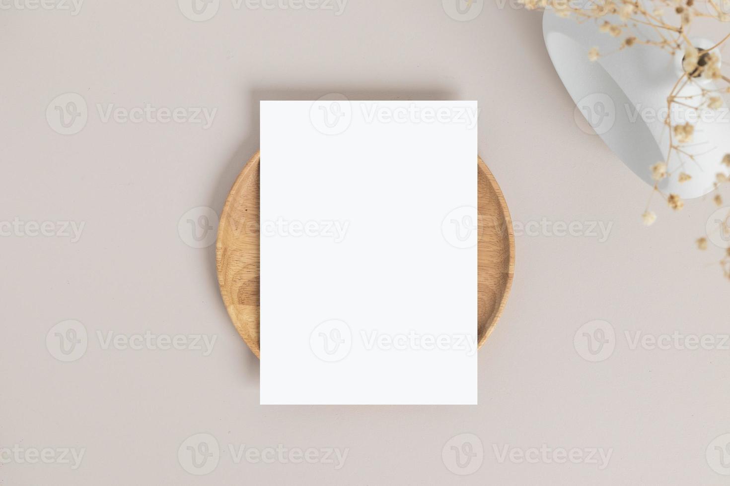 Blank greeting card invitation Mockup 5x7 on envelope with dry flowers and ribbon on paper background, flat lay, mockup photo