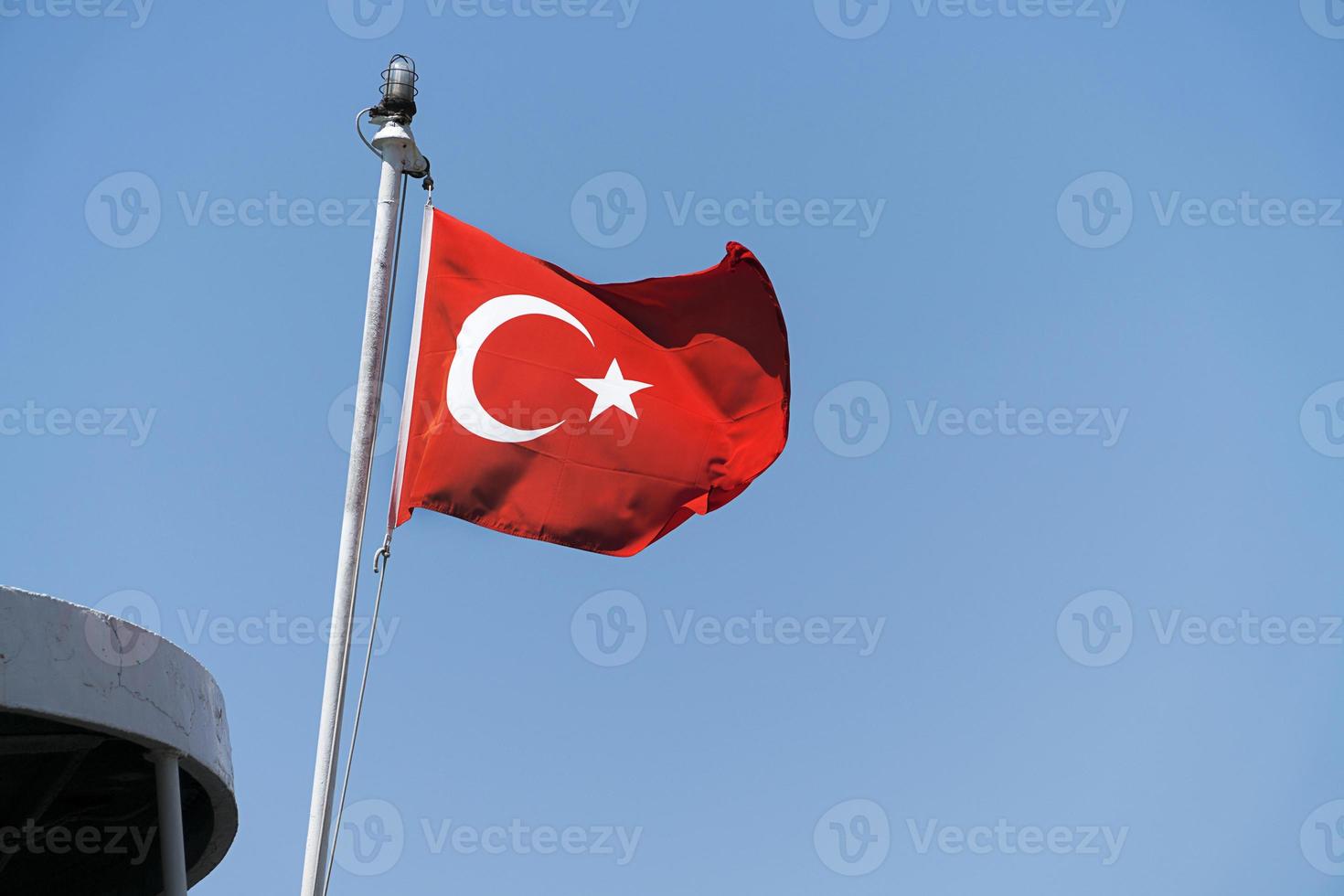 Turkish flag in blue sky background photo