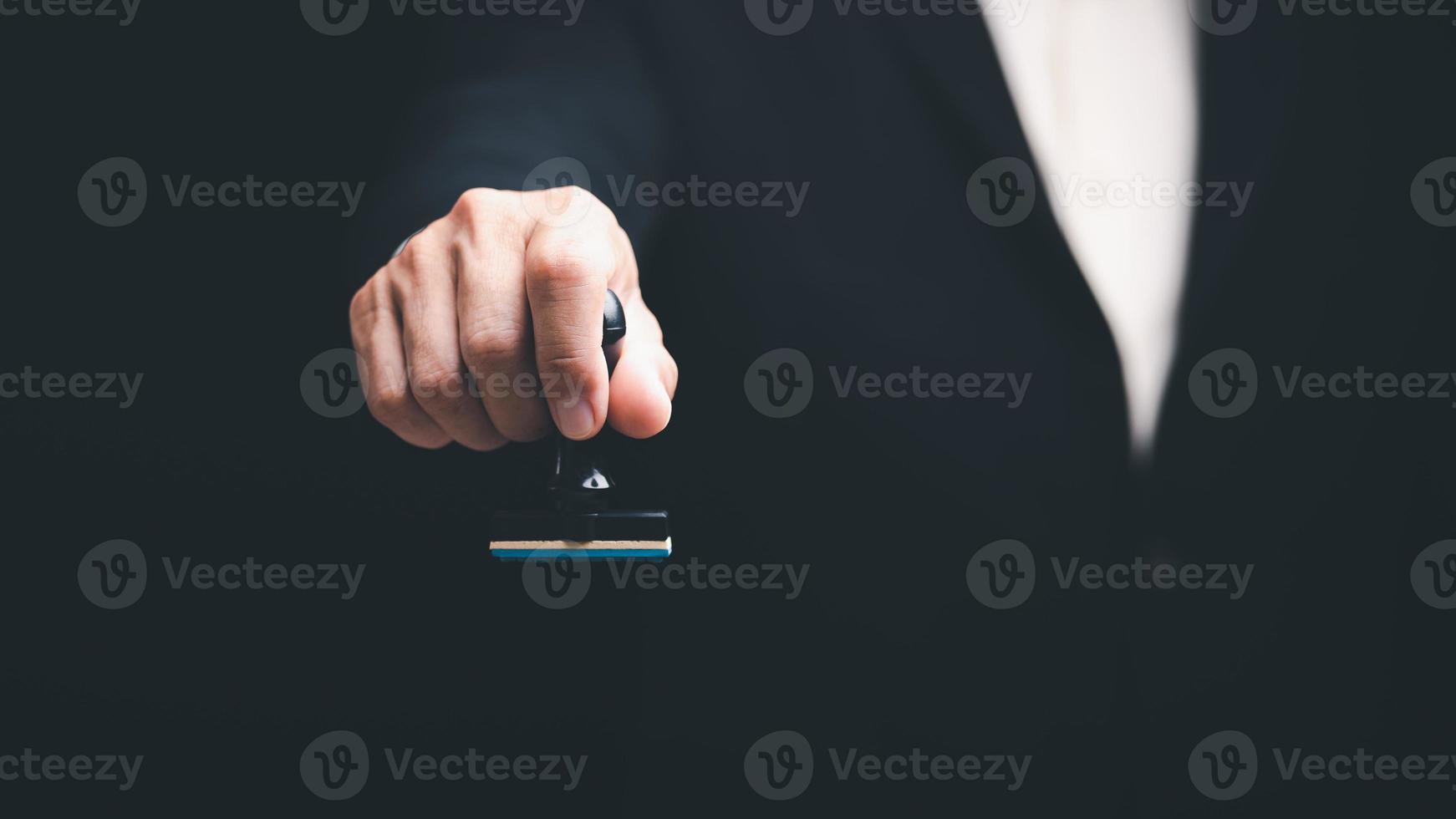 transaction management ideas and documents including negotiating legal entities and filling out legal forms or agreements,Young executives hold document stamps for business contracts photo