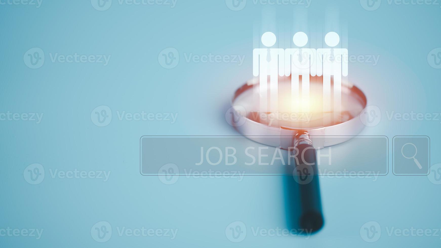 Magnifying glass on the table, job search and employment concept through online networking technology. Apply for jobs and jobs from companies through the Internet, photo