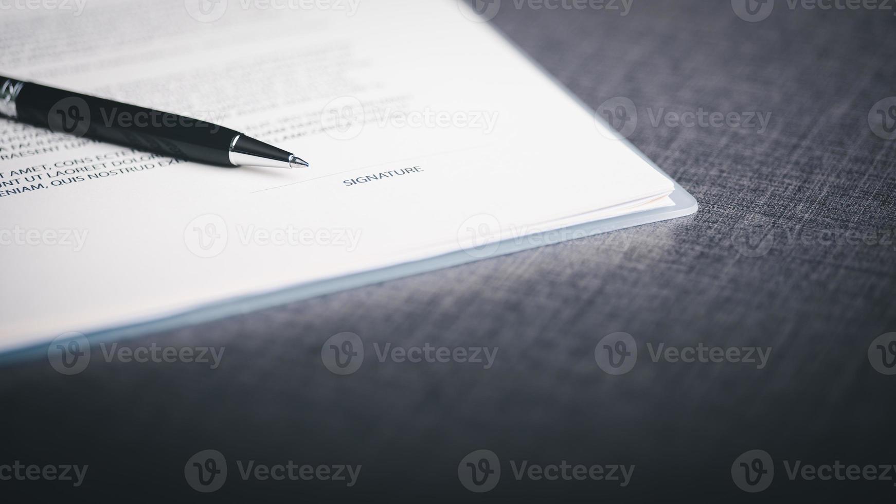 Concept of signing contract documents and making business agreements, acceptance and approval through legal form documents, paper and pen on the table, business contract agreement documents. photo