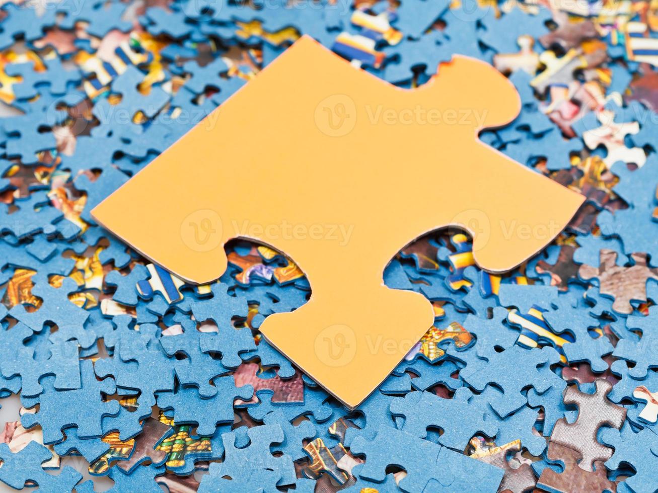 big puzzle piece on pile of disassembled puzzles 11845894 Stock Photo at Vecteezy