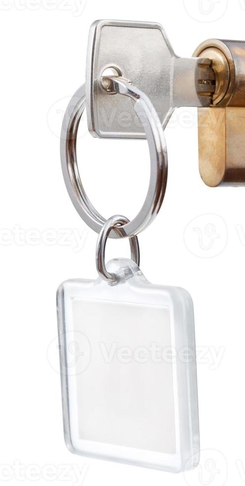 door key with square keychain in cylinder lock photo