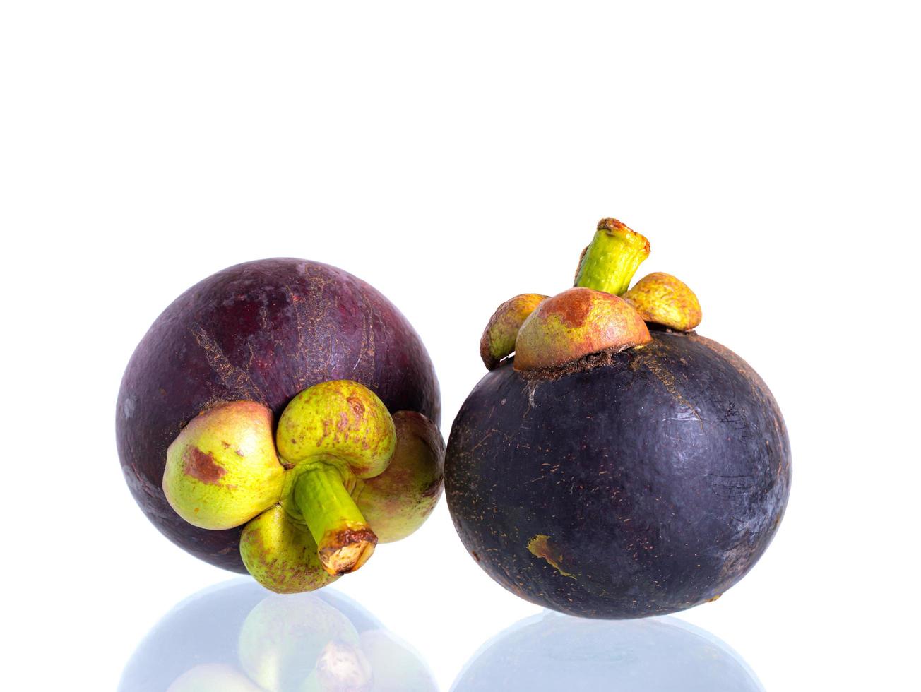 Fresh mangosteen fruit on the white photo