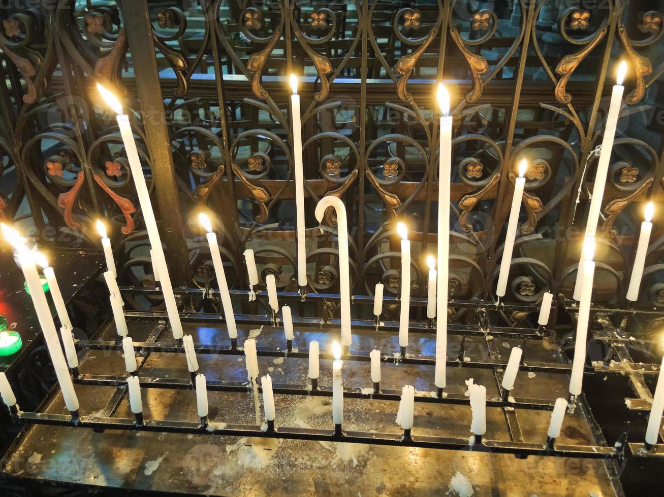 Lighted candles on altar of cathedral 11846607 Stock Photo at Vecteezy