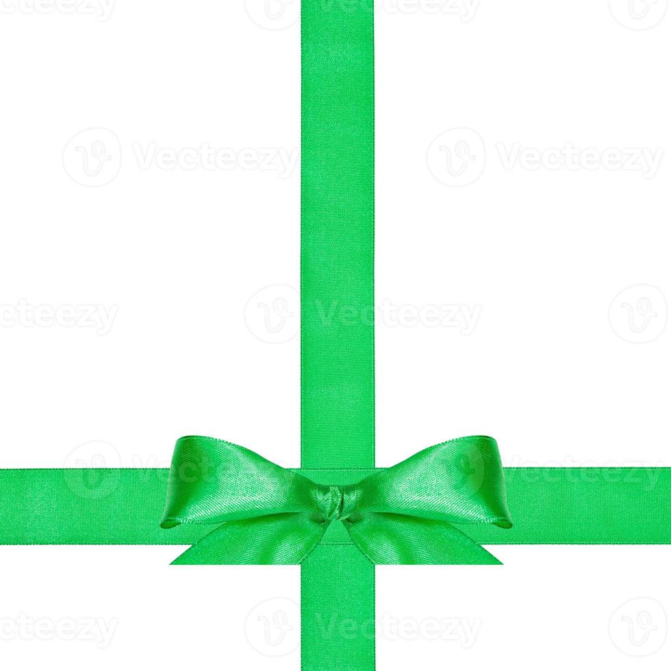 big green bow knot on two crossing satin ribbons photo