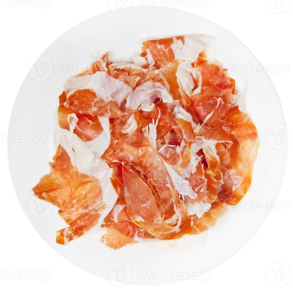 lonchas de jamón de parma prosciutto crudo en placa foto