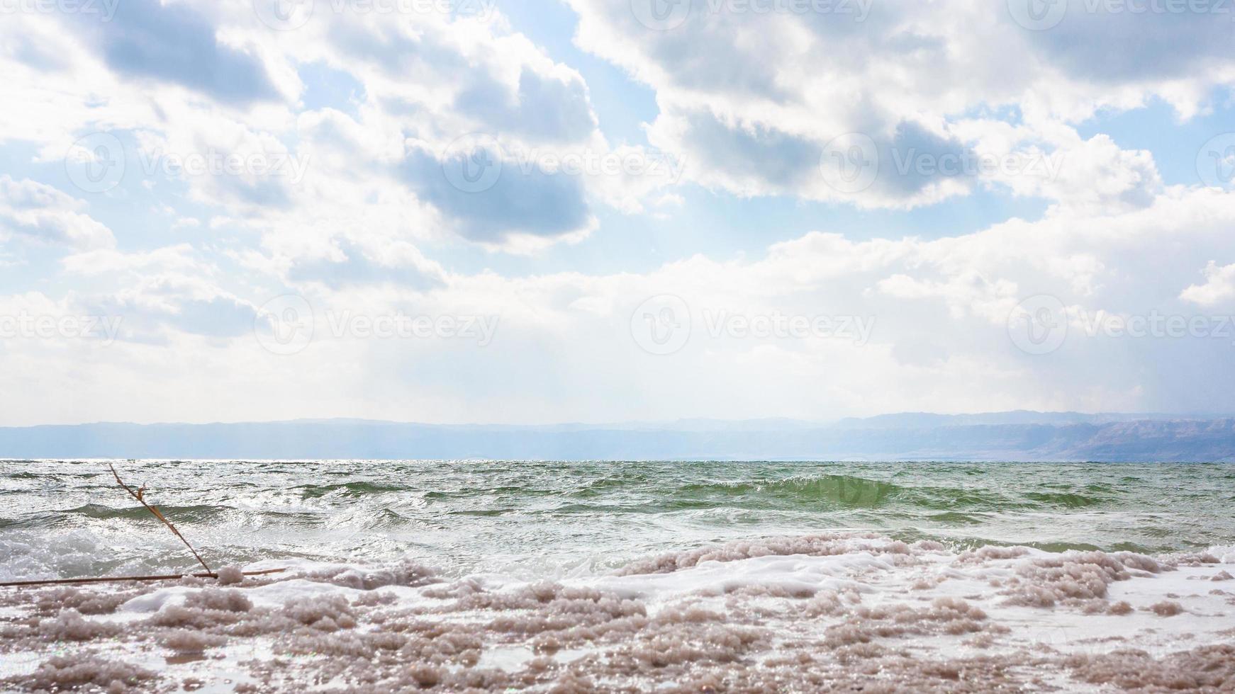 crystalline coastline of Dead Sea shore in winter photo