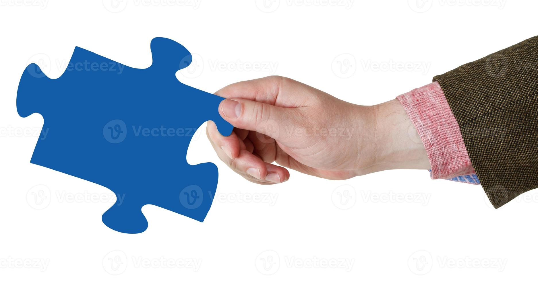 male hand with blue puzzle piece photo