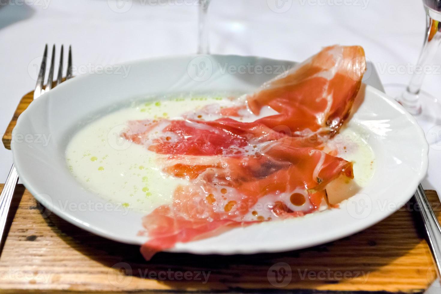 melt mozzarella with parma prosciutto crudo photo