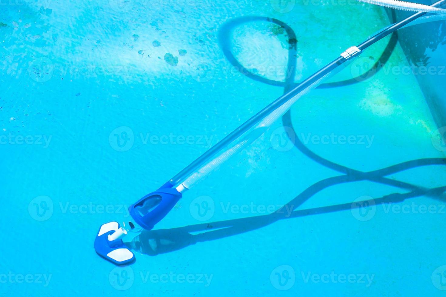 cleaining bottom of outdoor pool photo