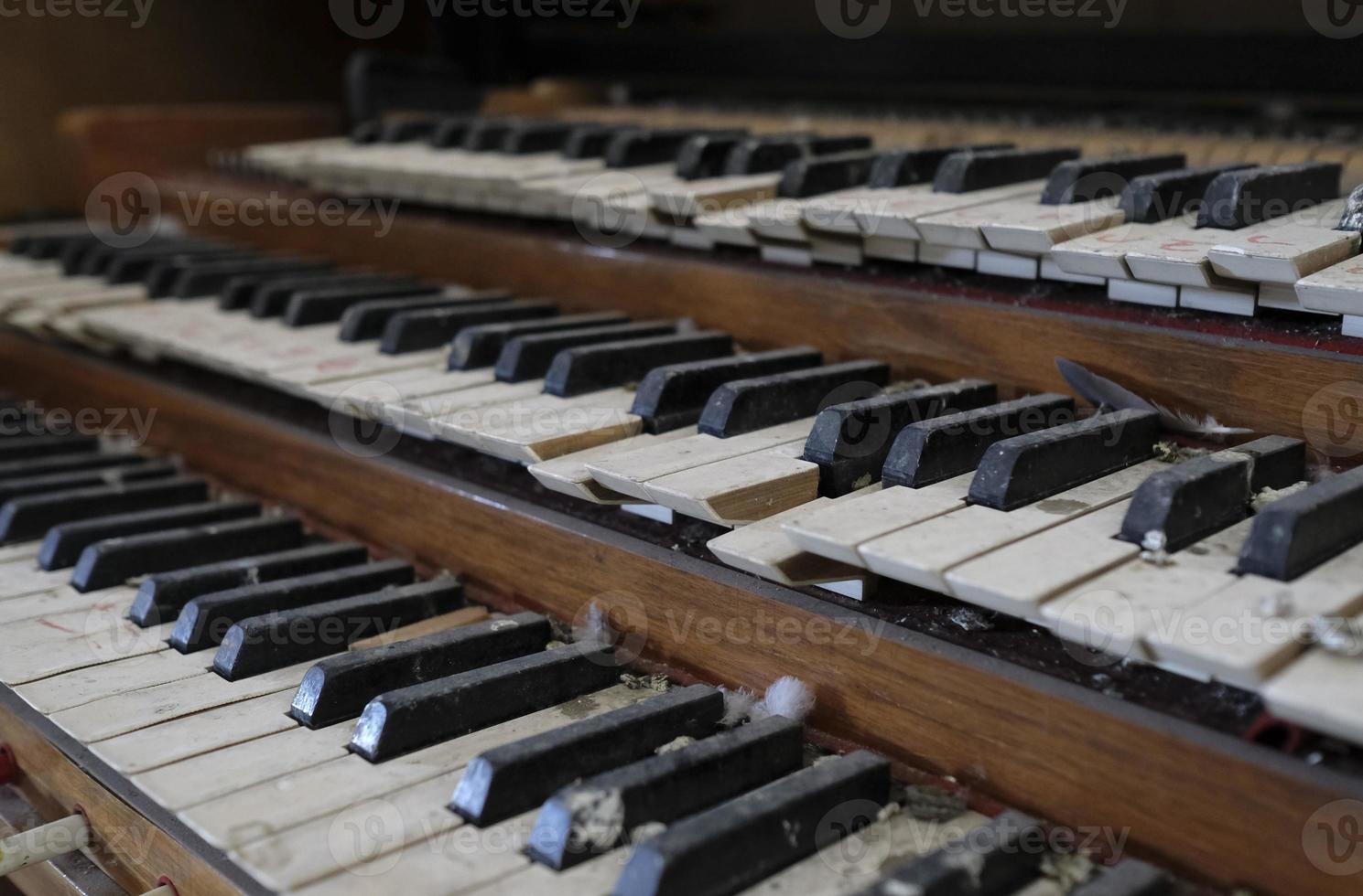 Closeup of an old organ in an abandoned church photo