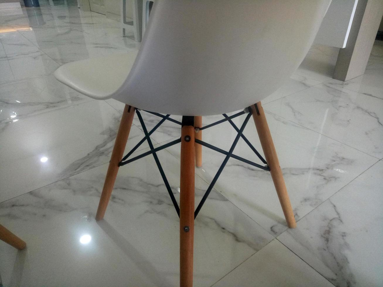 modern white chair on marble floor photo