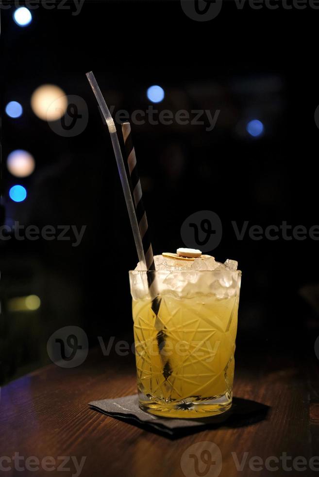 Beautiful cocktail in a glass with a blurred background photo