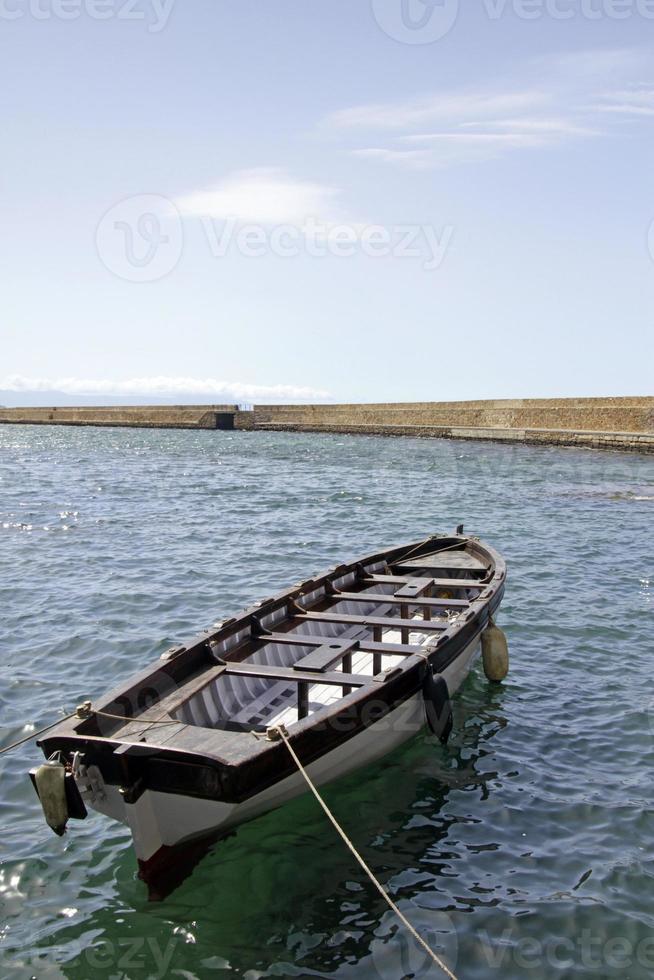 Boat in the calm bay of Chania, Crete photo