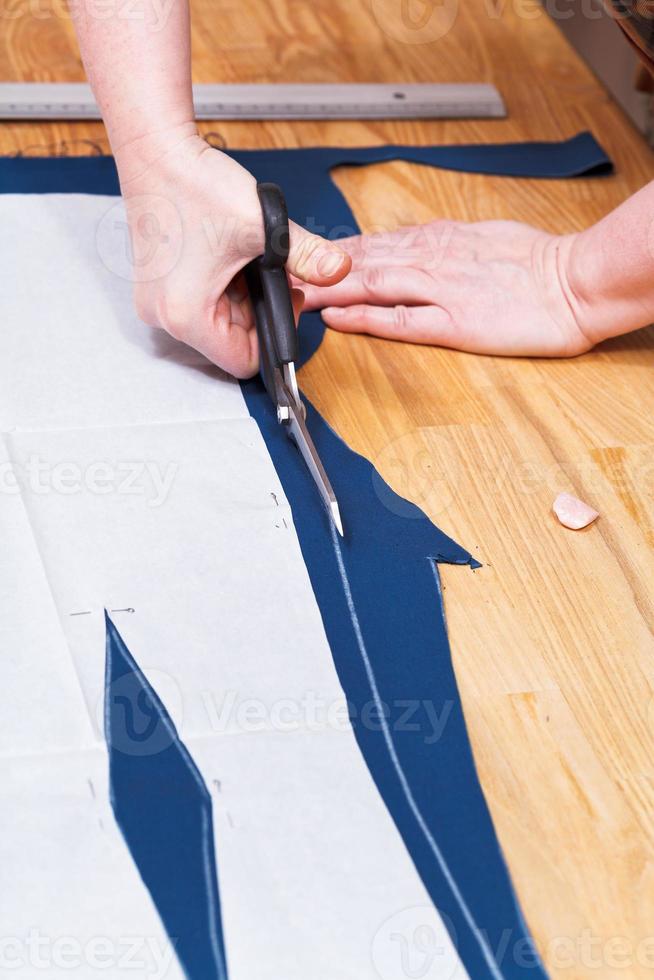 dressmaking clothes according with pattern photo