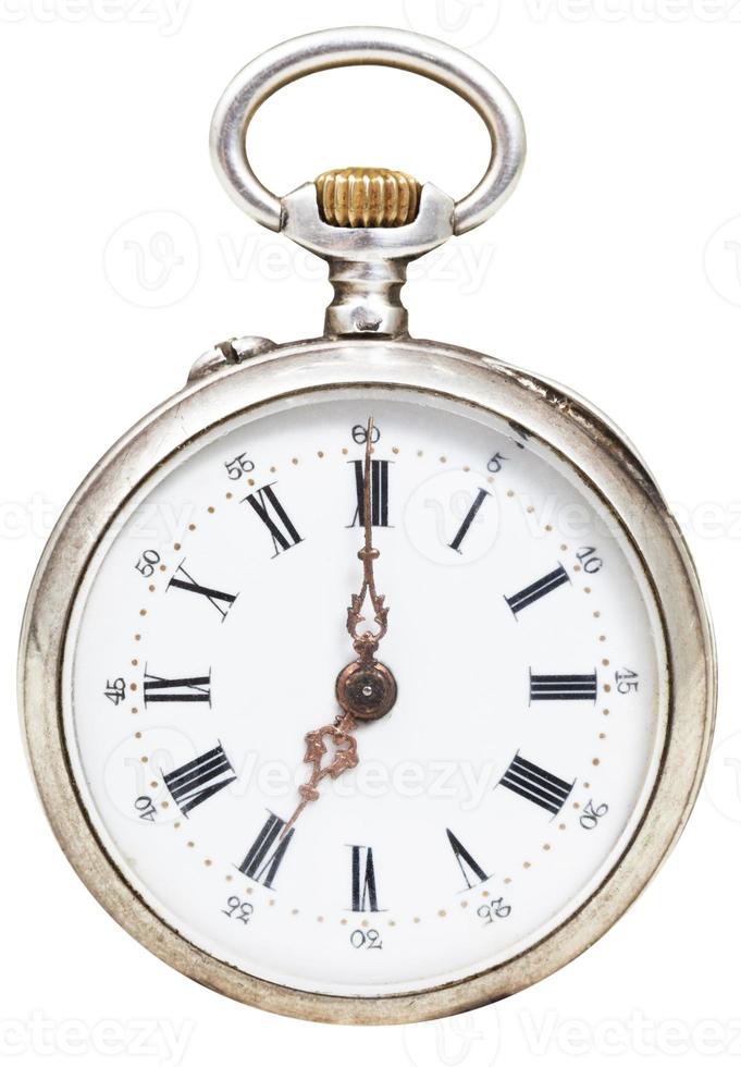 seven o'clock on the dial of retro pocket watch photo