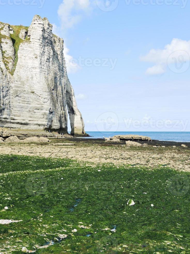 cliff on english channel beach during low tide photo