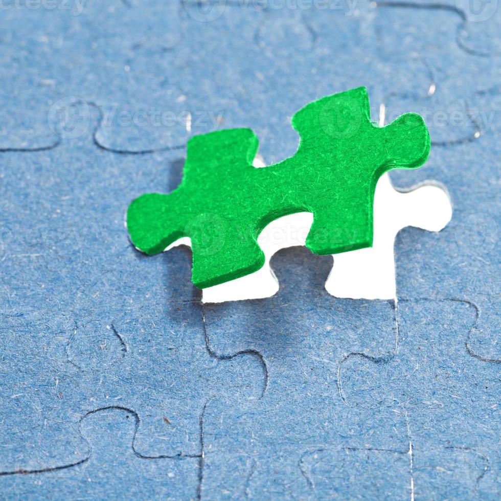 setting the last green piece of puzzle photo