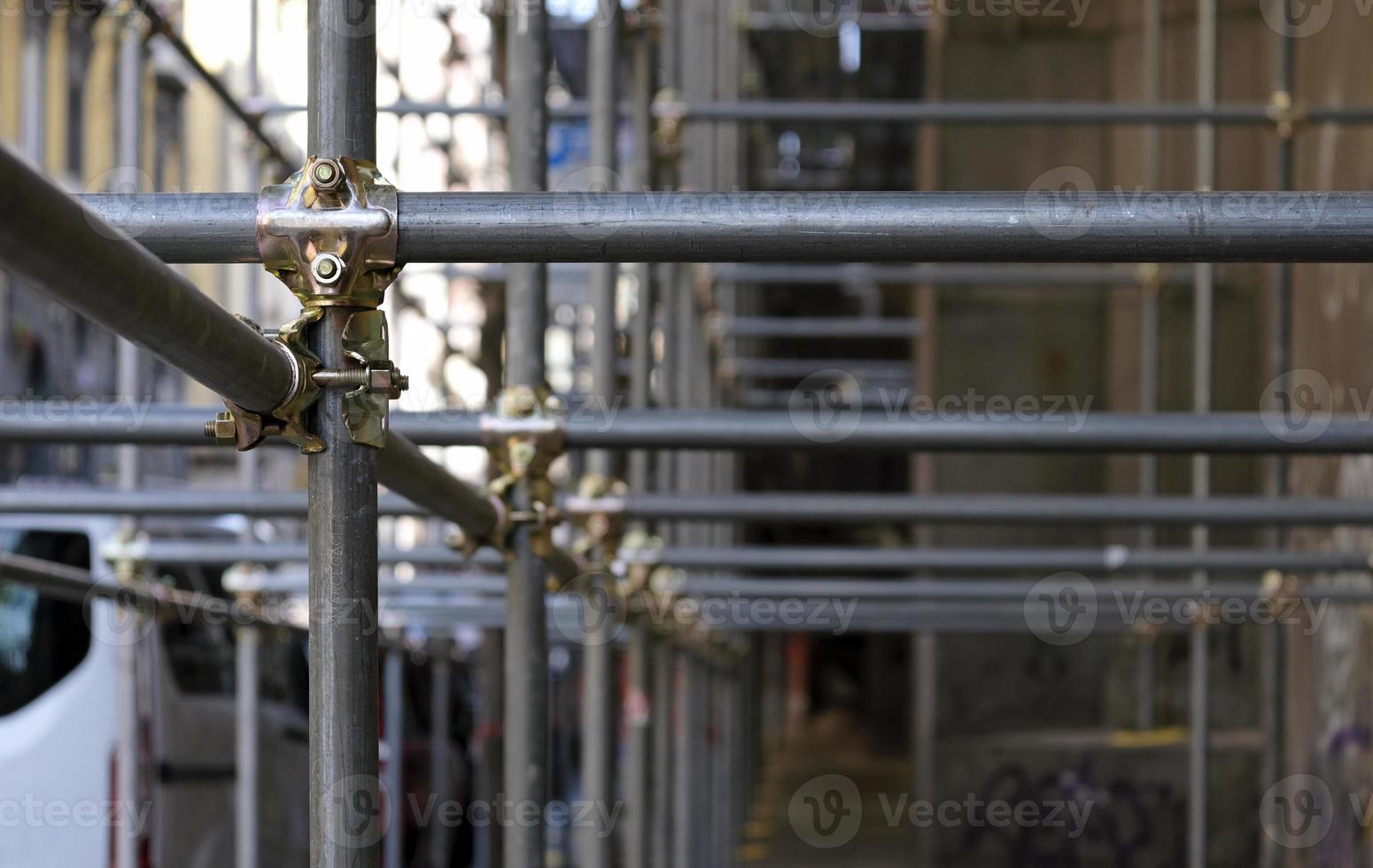 Construction to hold the scaffolding on a building in Naples, Italy photo