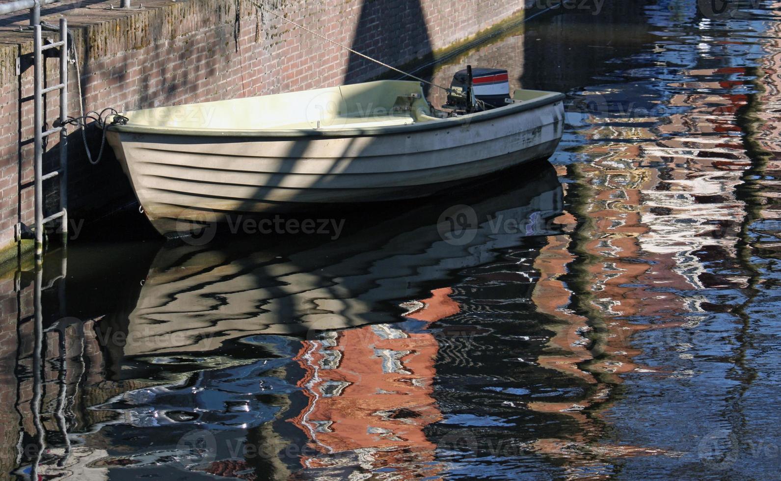 Simple boat on the water in Amsterdam, Netherlands photo