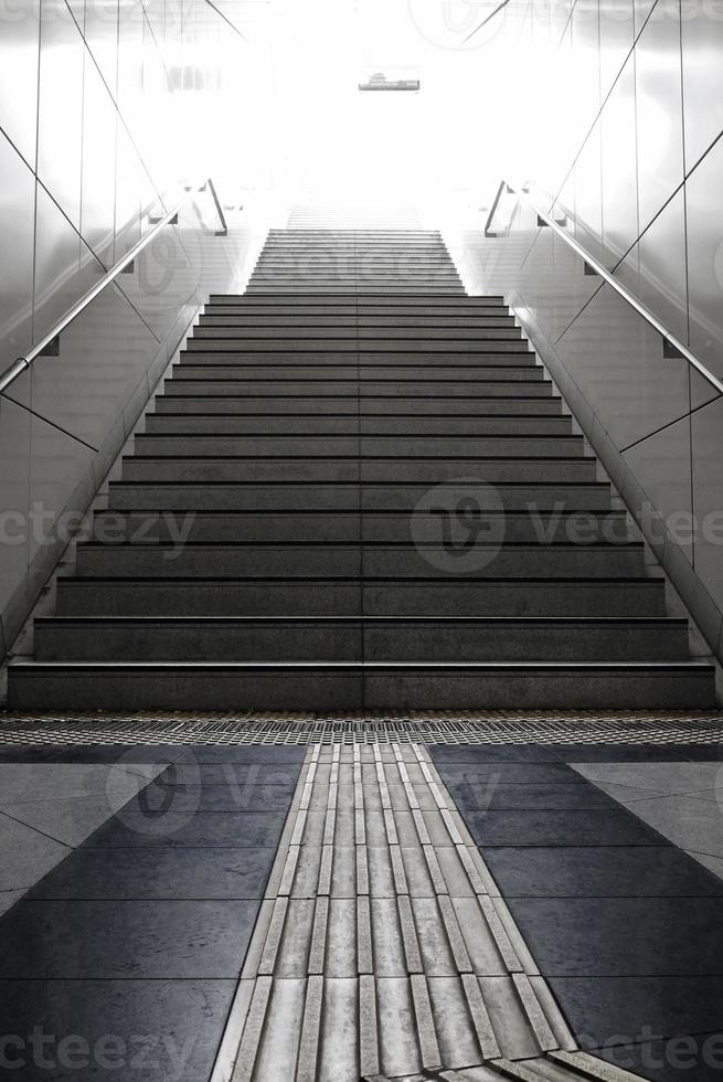 Staircase leading into the blinding day light in Dusseldorf, Germany photo