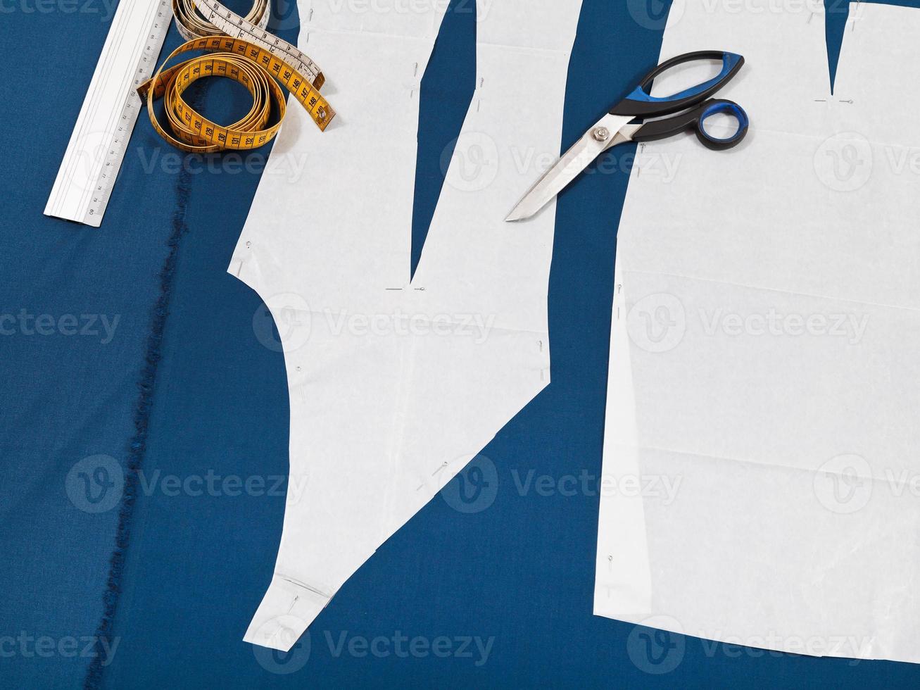 tailor tools and paper model of clothes photo