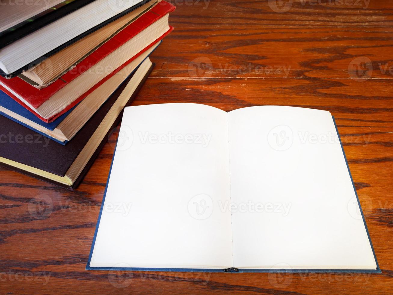 open book on wooden table photo