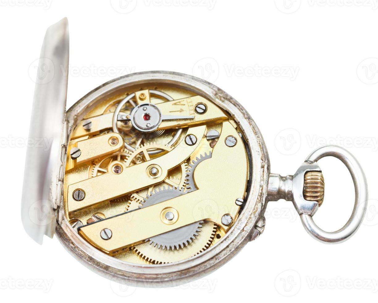 top view of brass clockwork of retro silver watch photo