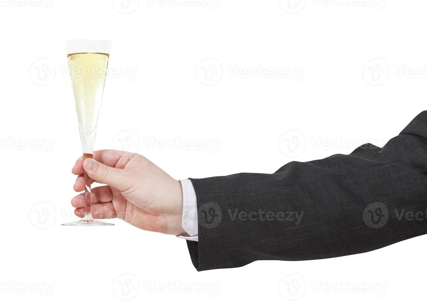 side view of champagne glass in male hand photo