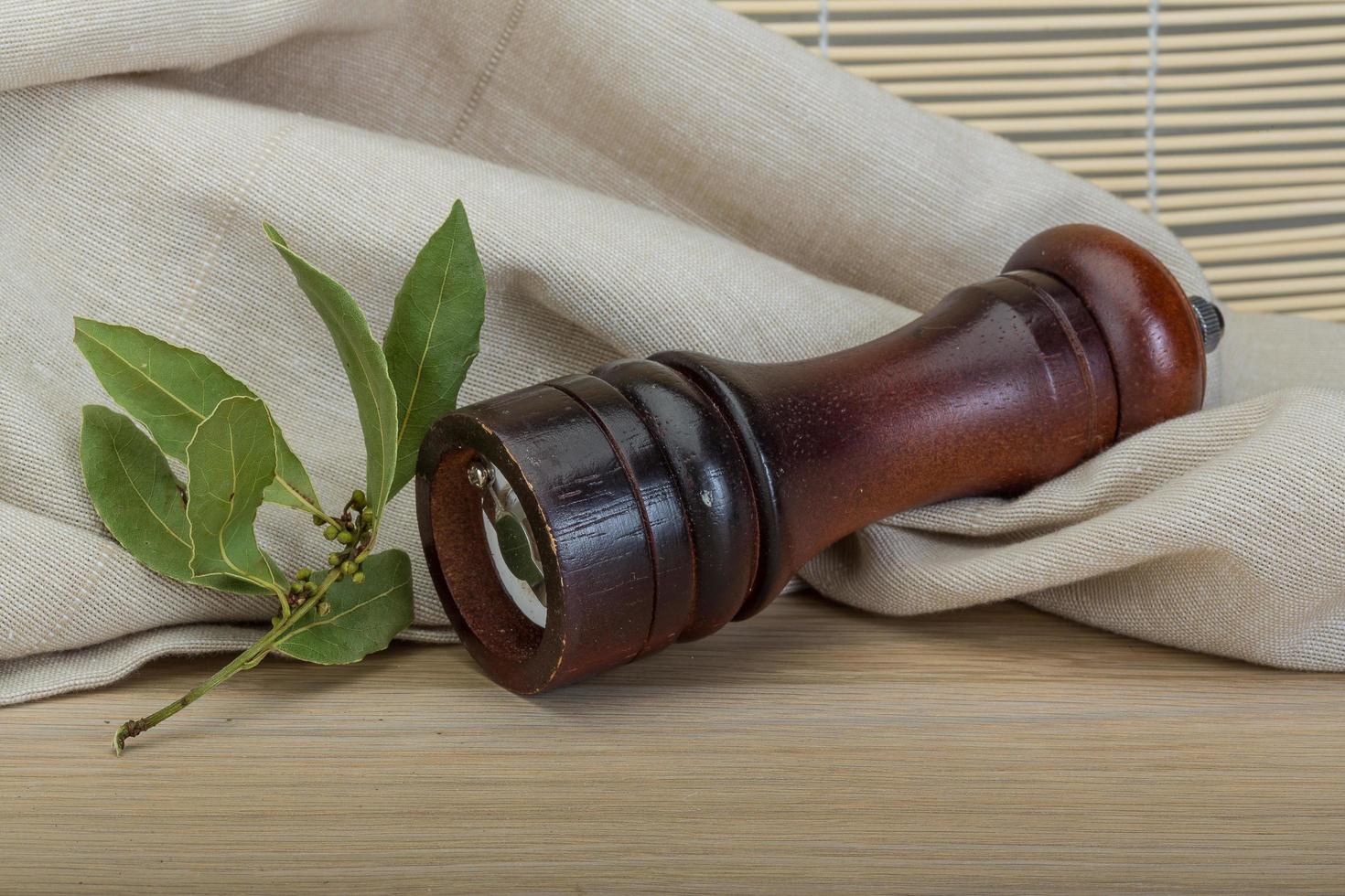Pepper mill with laurel photo