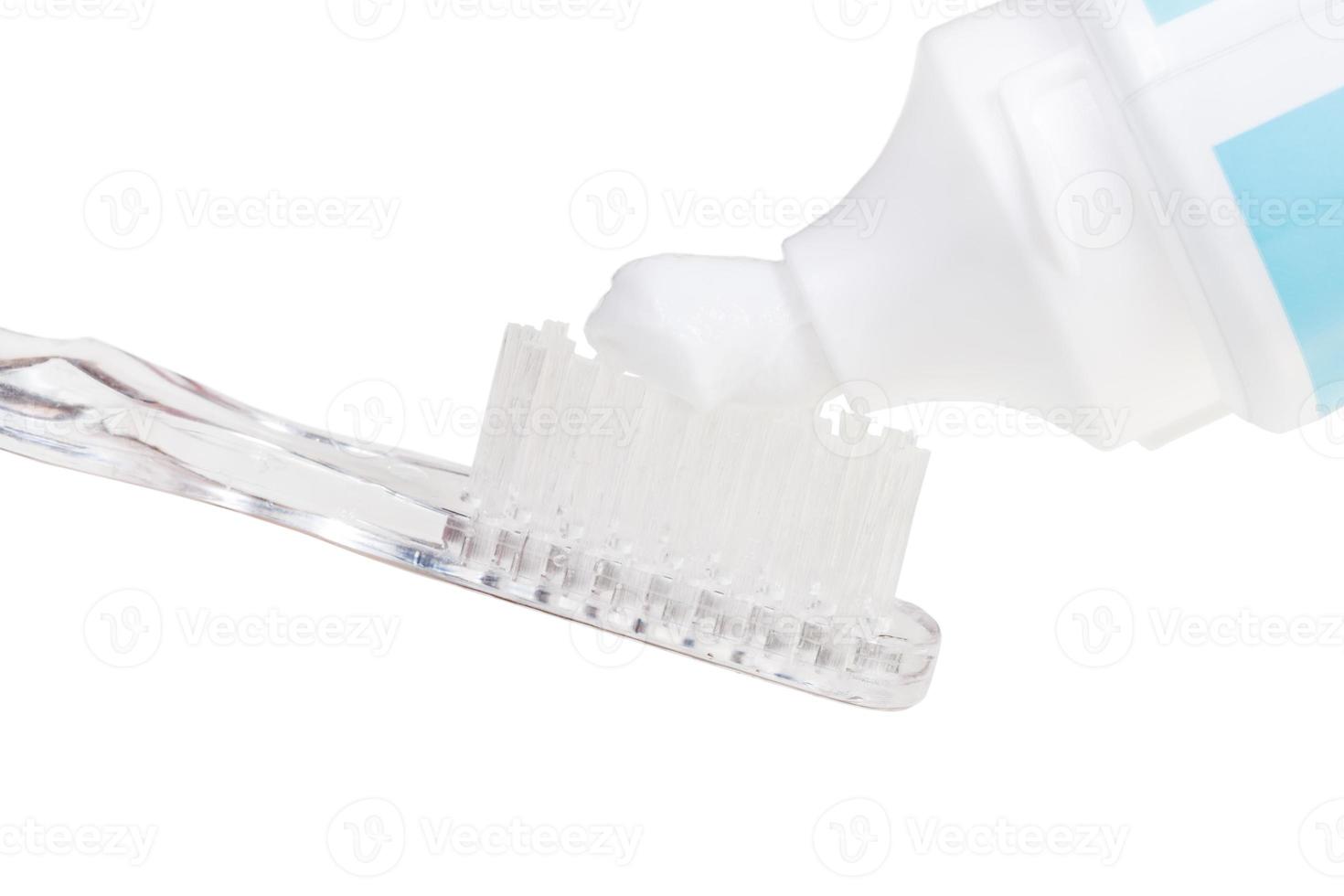 toothbrush and toothpaste from tube isolated photo