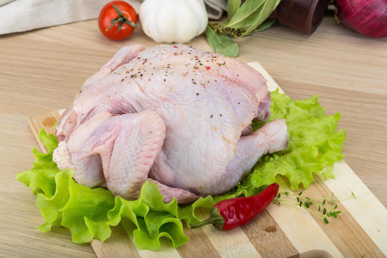 Quail on wooden board and wooden background photo