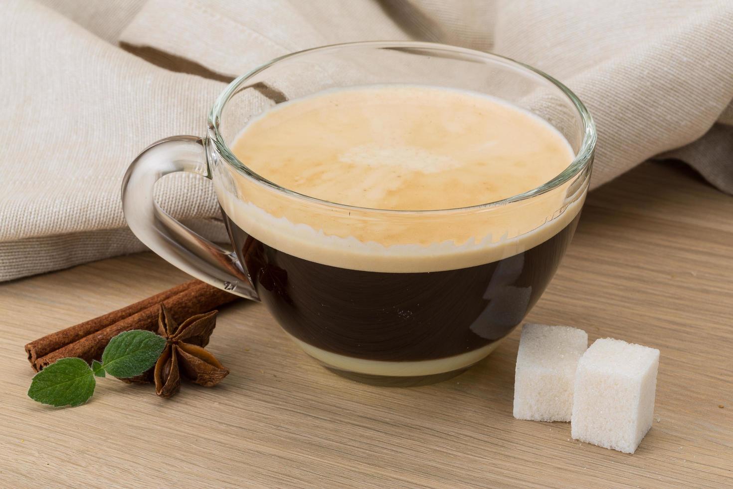 Cappuccino on wooden background photo