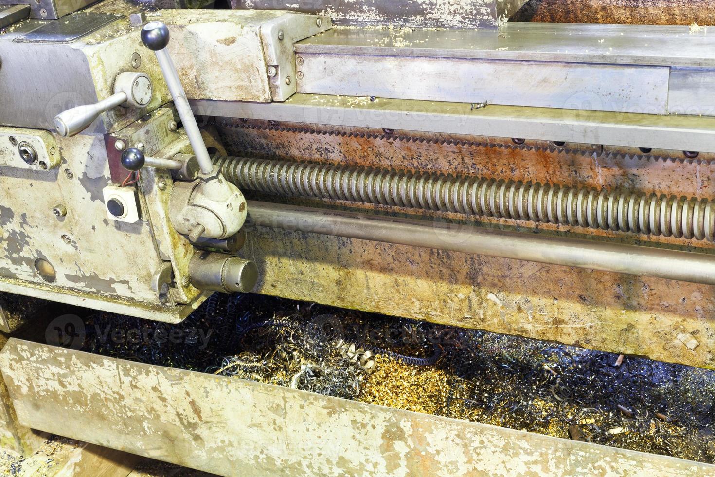 metal turning in sump of lathe machine photo
