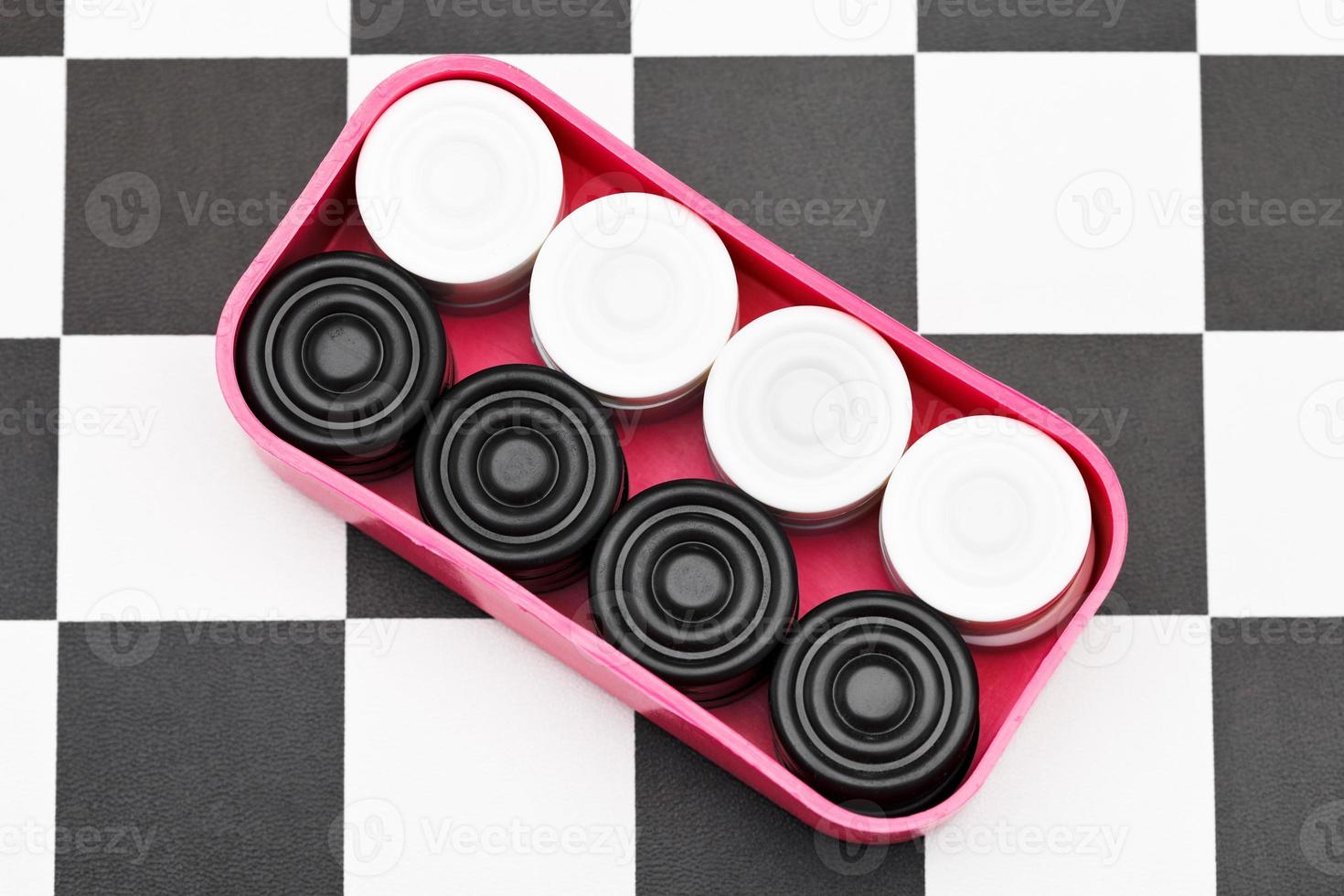 box with checkers on checkerboard photo