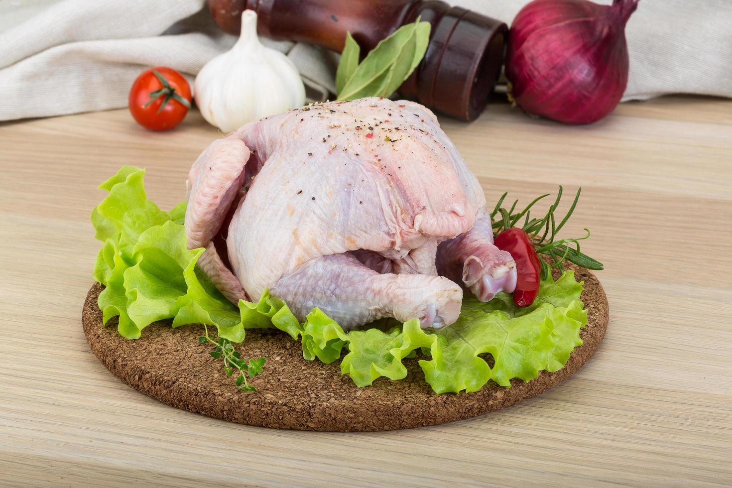 Quail on wooden board and wooden background photo