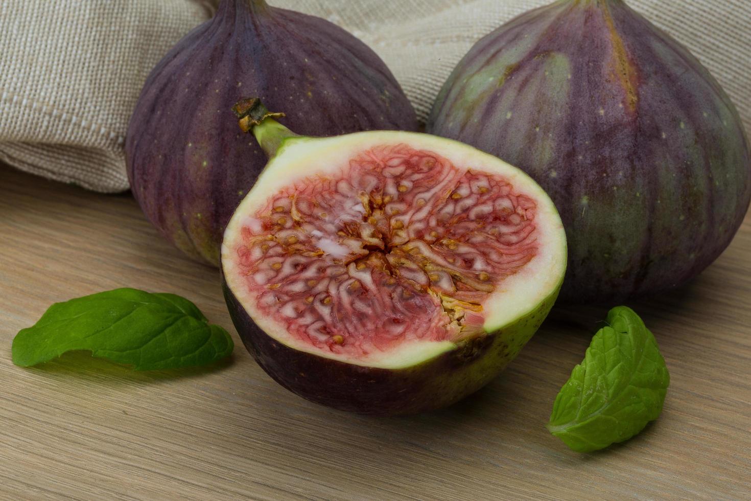 Figs on wooden background photo