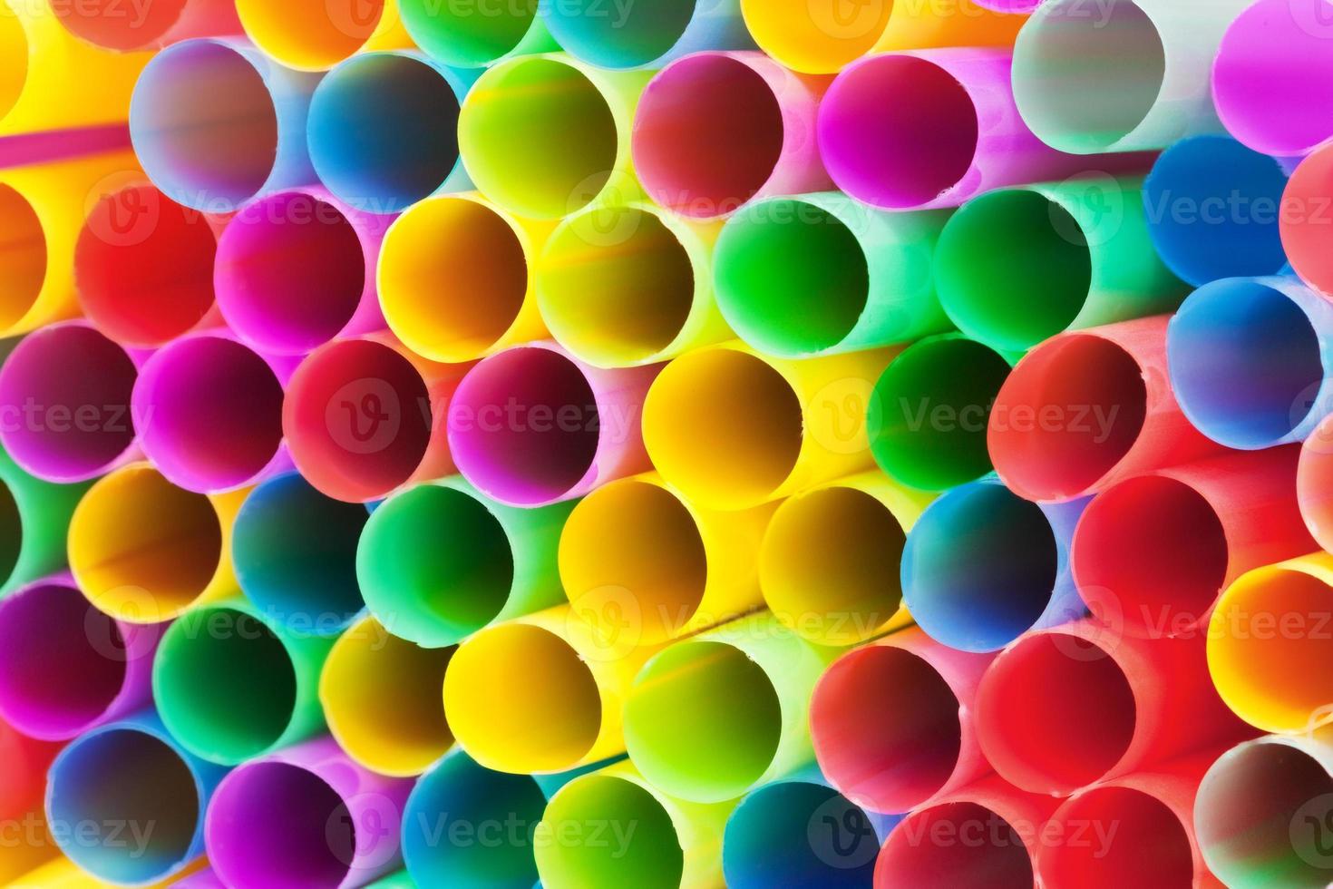 multicolored plastic drinking straws close up photo