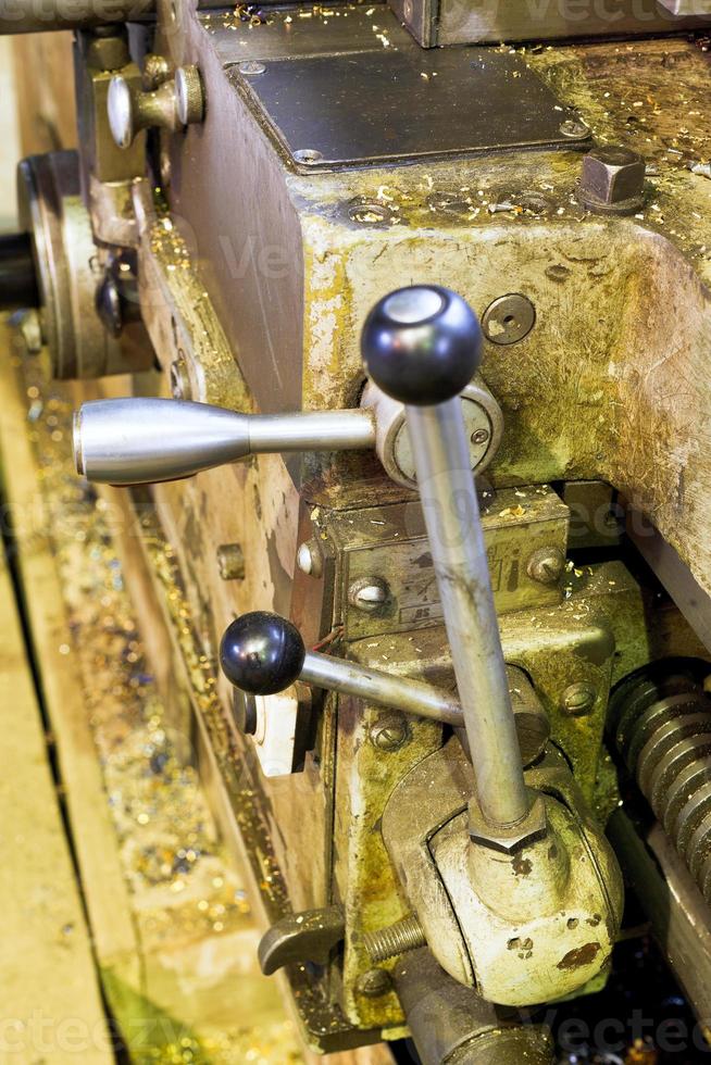 handles of metal lathe machine close up photo