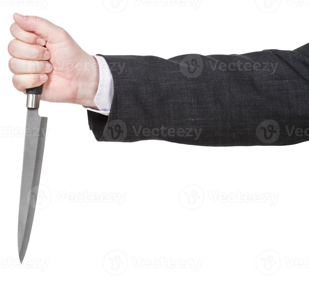 side view of knife in male hand photo