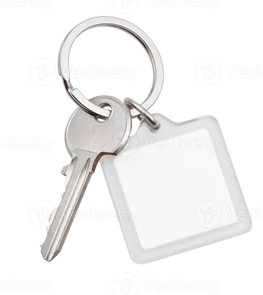 one house key and square keychain on ring photo