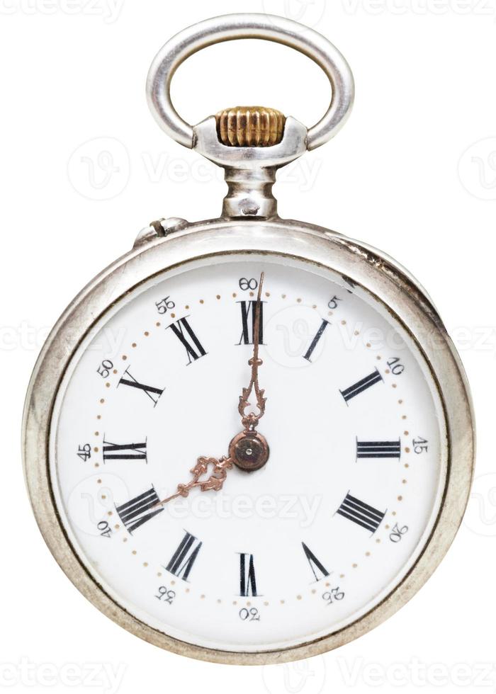 eight o'clock on the dial of retro pocket watch photo