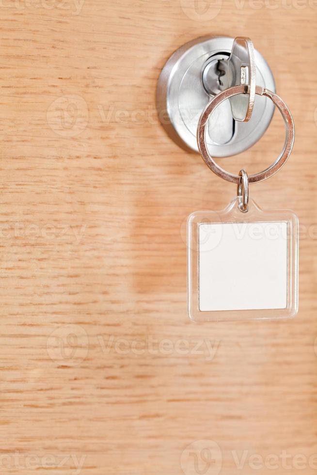 key with blank square keychain in lock photo